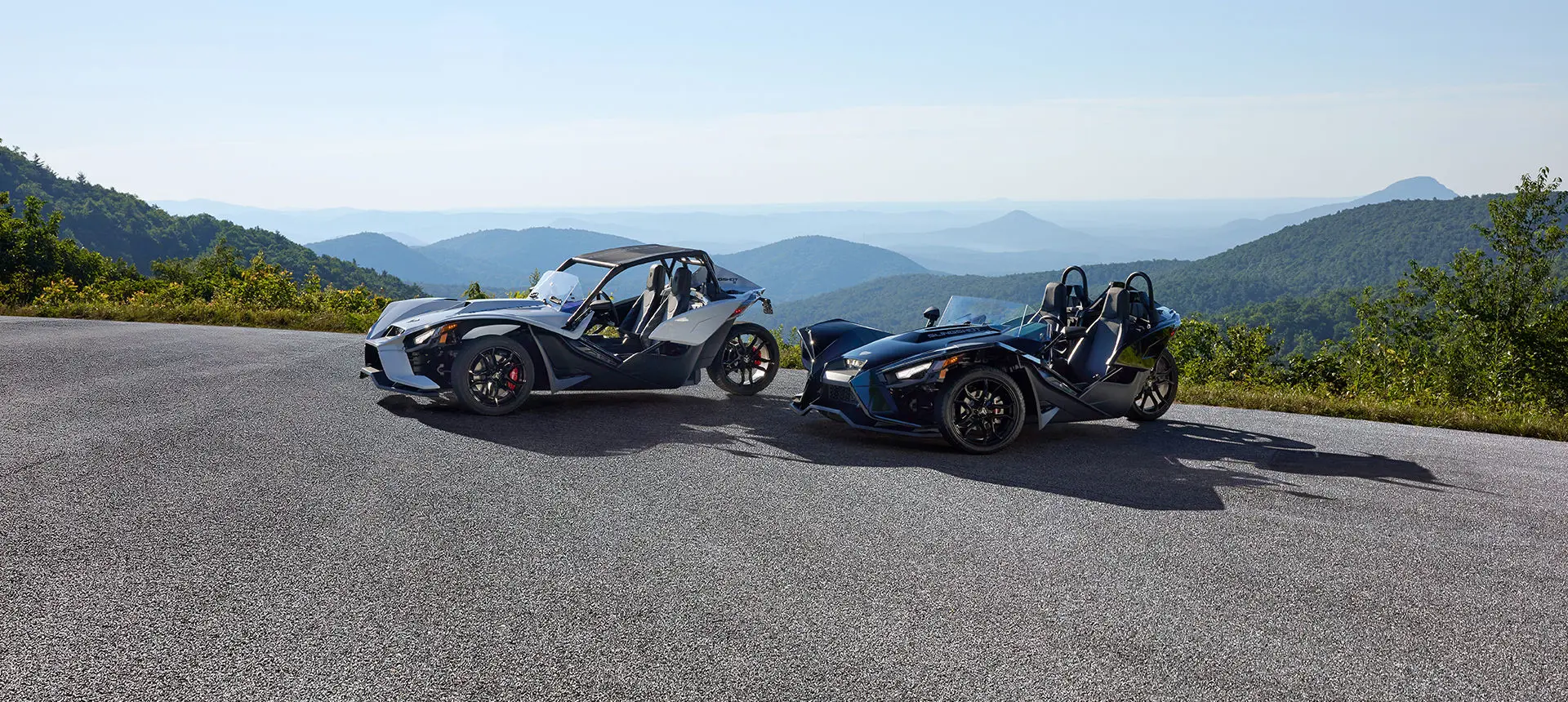 2 polaris slingshot s three-wheeled motorcycles