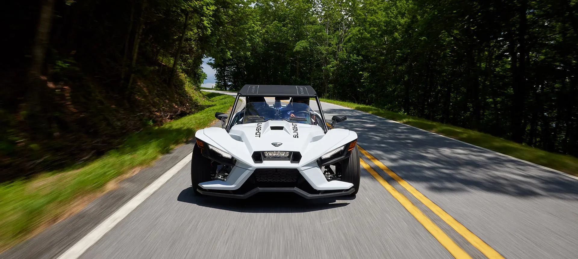 front end view of a polaris slingshot s roadster on a highway
