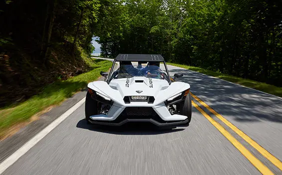 front end view of a polaris slingshot s roadster on a highway