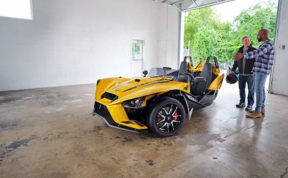 person showing off their 2024 slingshot r three-wheeled motorcycle