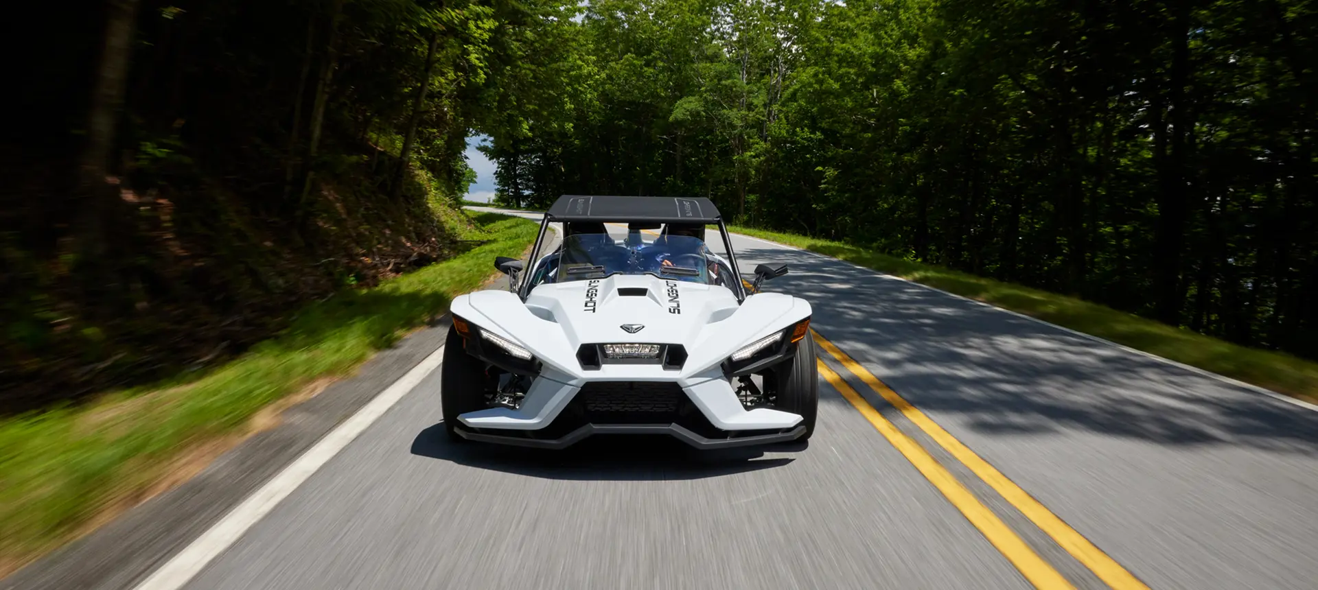 front view of a 2024 slingshot s three-wheeled motorcycle on a road