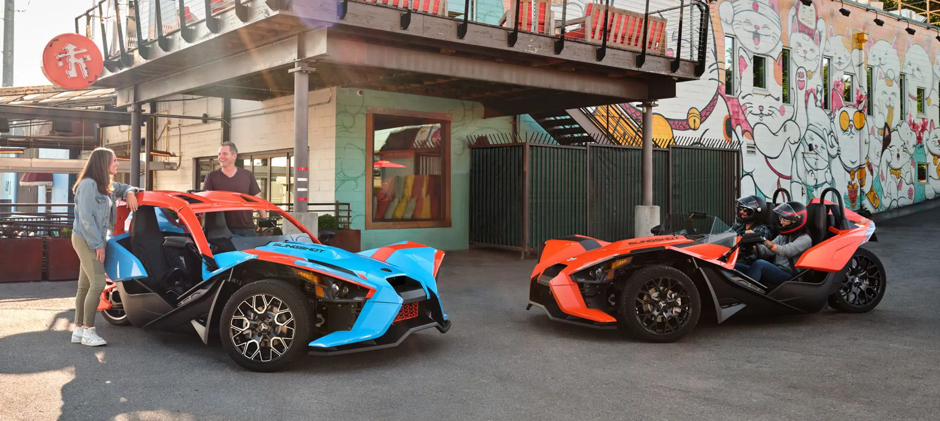 people meeting up in their polaris slingshot SL three-wheeled motorcycles