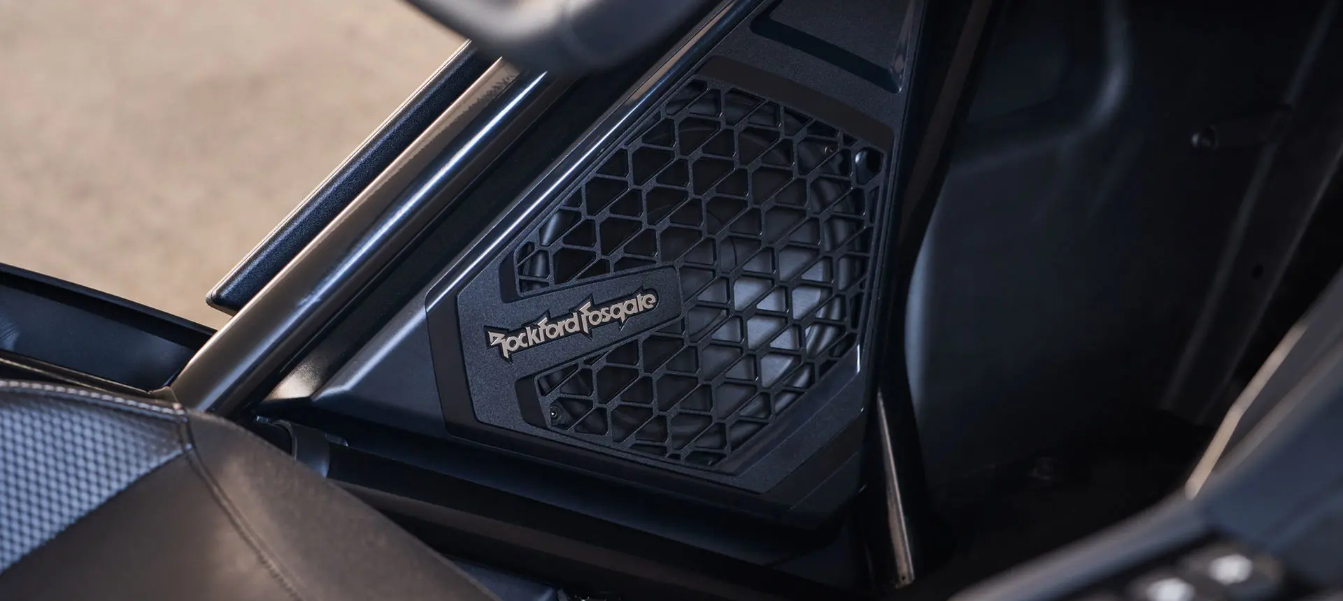 Close-up view of a Rockford Fosgate® Audio System speaker on a 2025 Polaris Slingshot R three-wheeled motorcycle