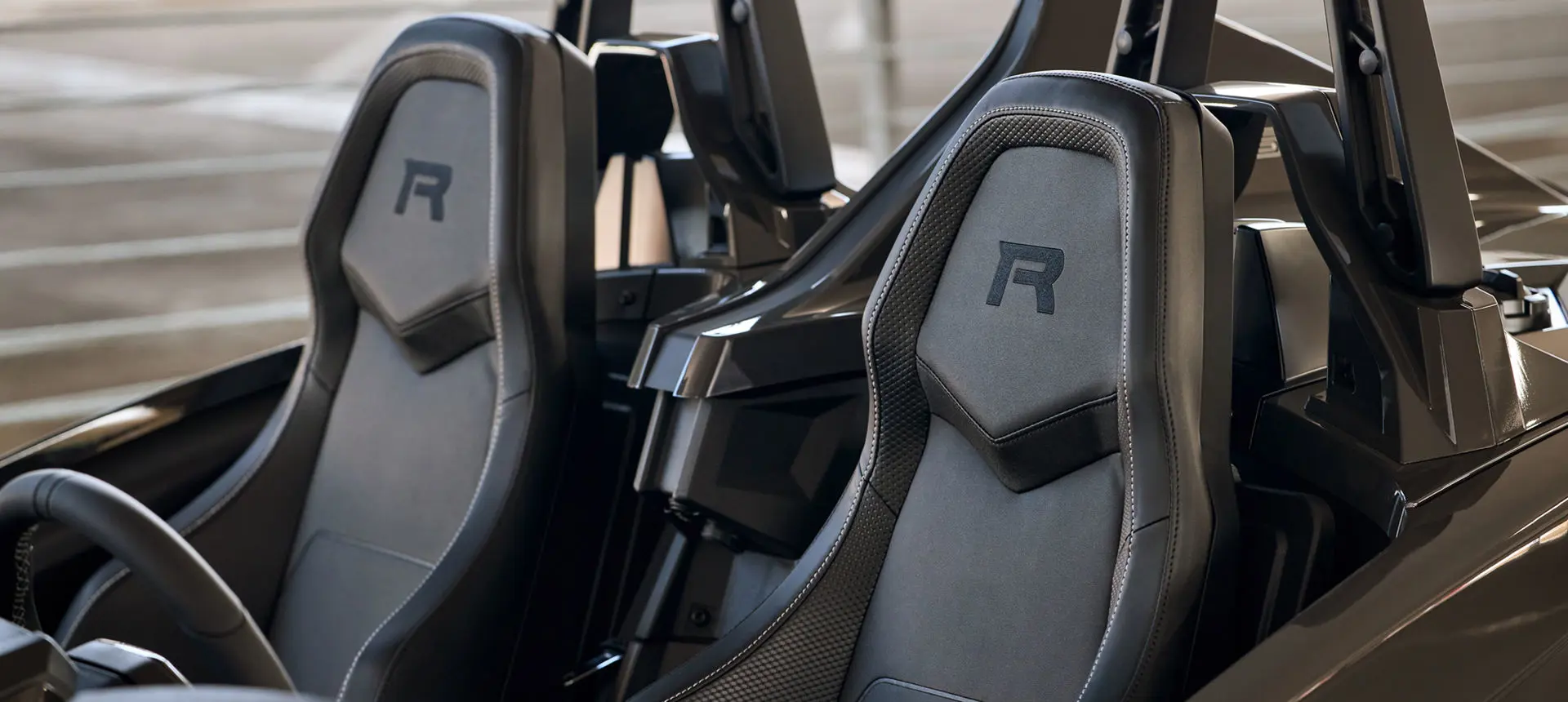 Two R exclusive seats on a 2025 Polaris Slingshot R three-wheeled roadster.