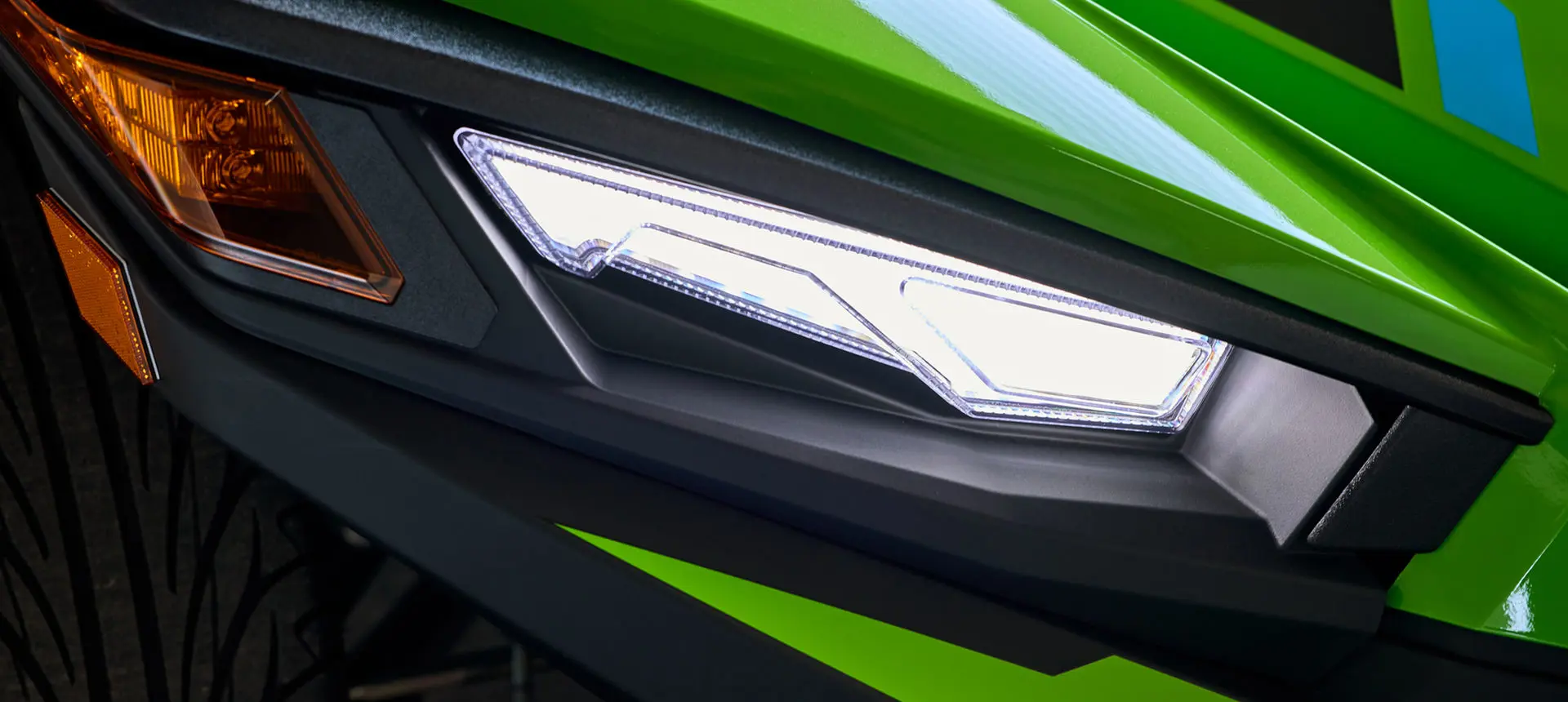 LED Headlight with Upper Accent Lighting on a Liquid Lime 2025 Polaris Slingshot SL 3-wheeled motorcycle.