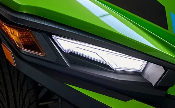LED Headlight with Upper Accent Lighting on a Liquid Lime 2025 Polaris Slingshot SL 3-wheeled motorcycle.