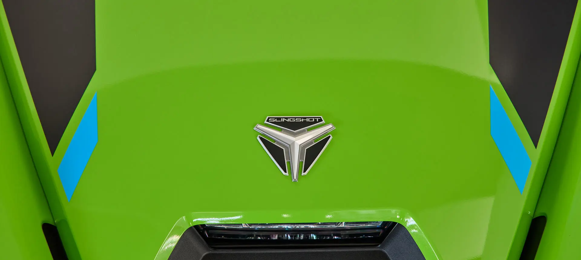 Close-up of the hood on a Liquid Lime 2025 Polaris Slingshot SL.