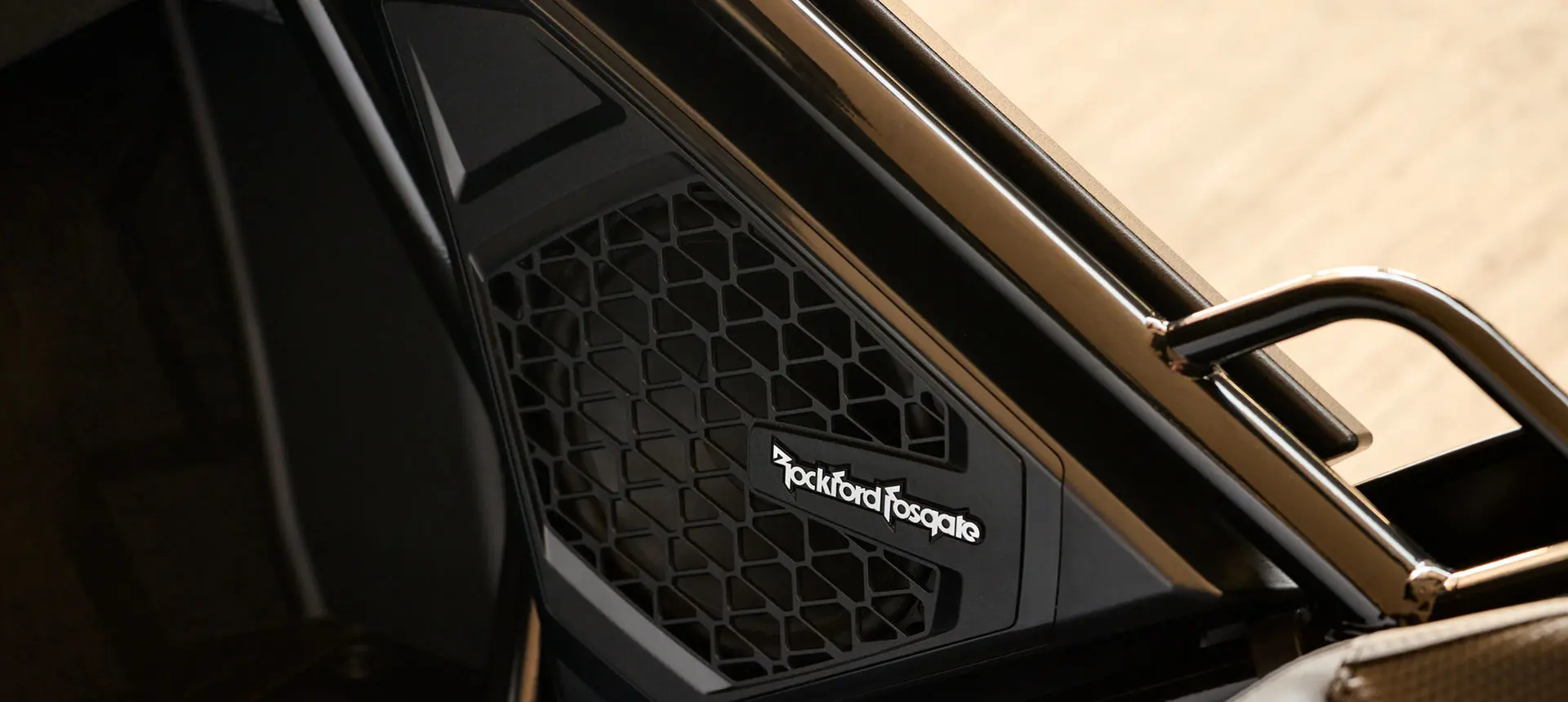 Closeup of the Rockford Fosgate audio speakers in a 2026 Polaris Slingshot SLR three-wheel motorcycle.