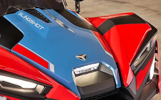 Closeup of the front end of a 2025 Polaris Slingshot SLR three-wheeled roadster.
