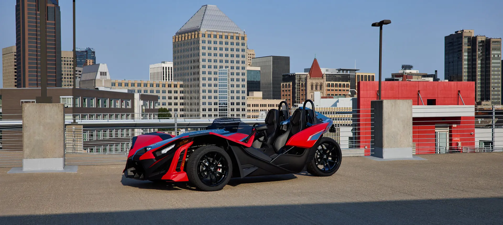 Side profile of a 2025 Polaris Slingshot SLR three-wheeled motorcycle.