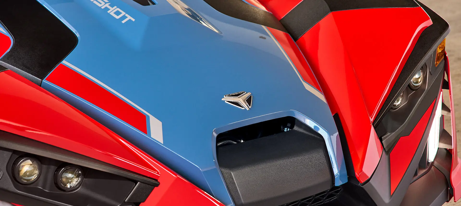 Closeup of the front end of a 2025 Polaris Slingshot SLR three-wheeled roadster.