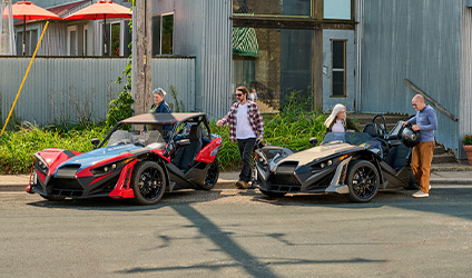 Polaris Slingshot parked in front of a house