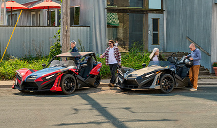 Polaris Slingshot parked in front of a house