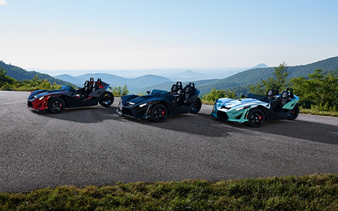 3 2026 three-wheel Polaris Slingshots parked in a lineup.