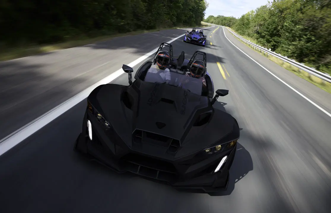 A 2026 Slingshot R three-wheel roadster cruising down the highway.