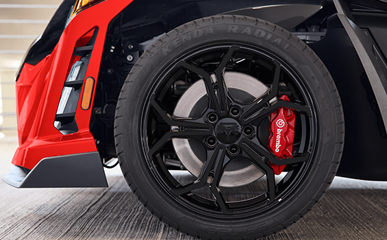 Closeup of the Brembo brakes and wheels on a 2026 Polaris Slingshot R three-wheel roadster.