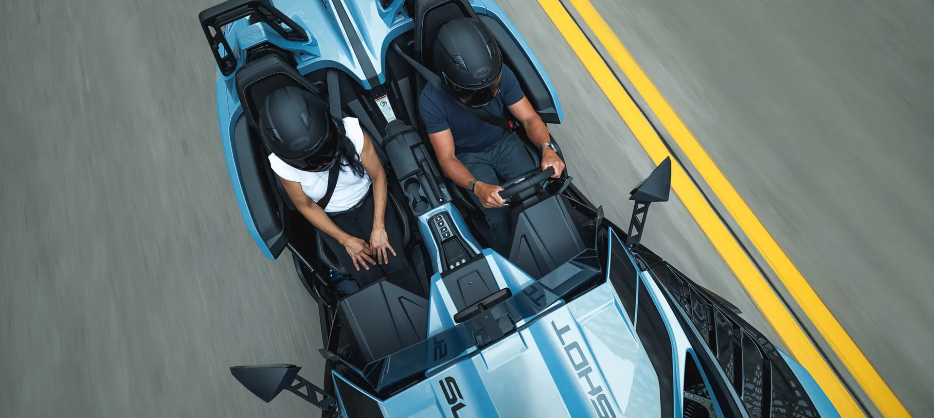 Overhead view of 2 riders in a 2026 Polaris Slingshot Signature Edition 3-wheeled roadster.