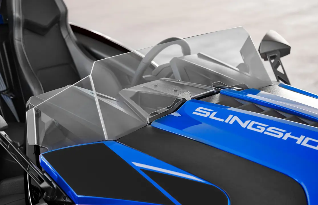 Closeup of the windshield on a 2026 Polaris Slingshot SLR three-wheel roadster.