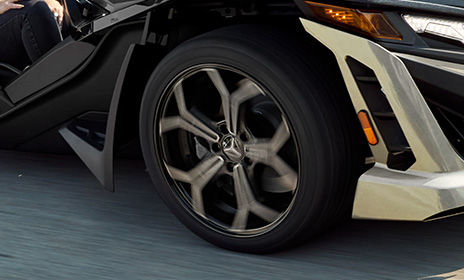Close-up of the 5-spoke honeycomb wheel design on a 2026 Polaris Slingshot SLR three-wheel motorcycle.