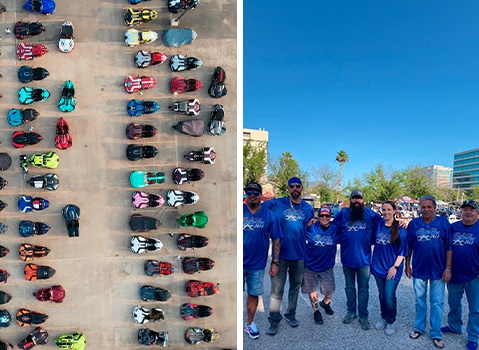 Aerial view of colorful Polaris Slingshot autocycles beside a group of attendees wearing Slingshot Experience event shirts.