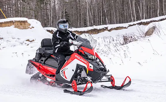 trail riding on a polaris indy adventure x2 snowmobile