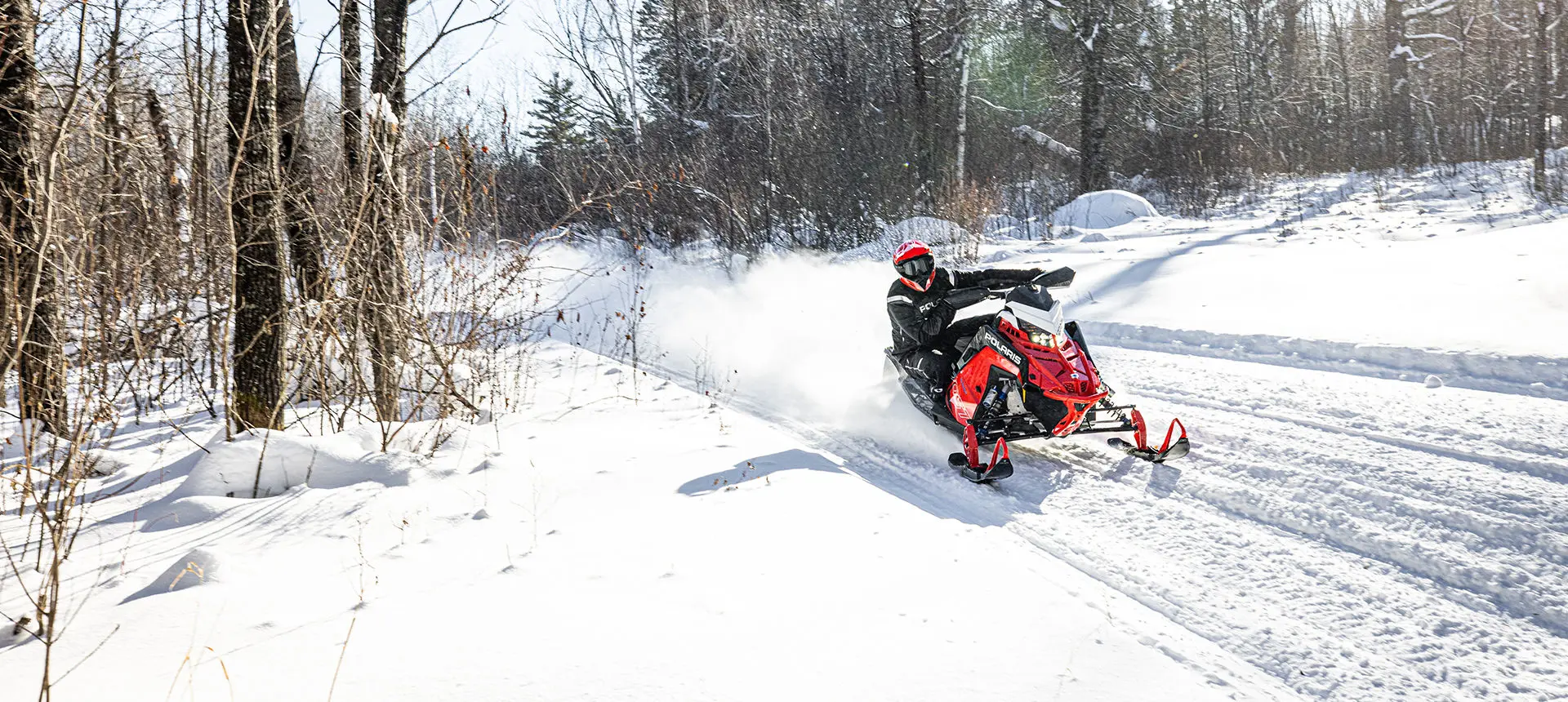 rider taking a corner on an indy vr1 snowmobile