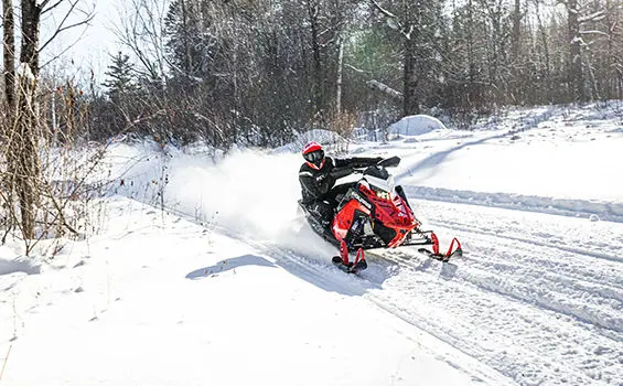 rider taking a corner on an indy vr1 snowmobile