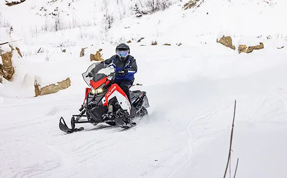 front view of a rider on a polaris indy xc snowmobile