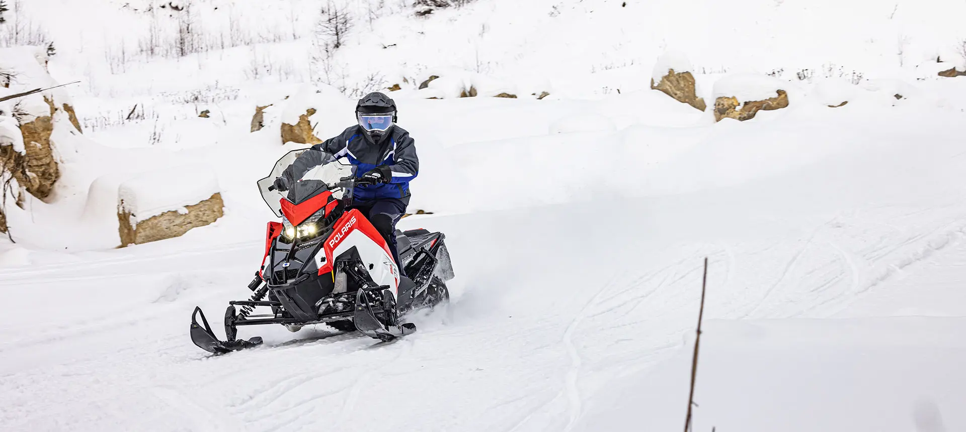 front view of a rider on a polaris indy xc snowmobile