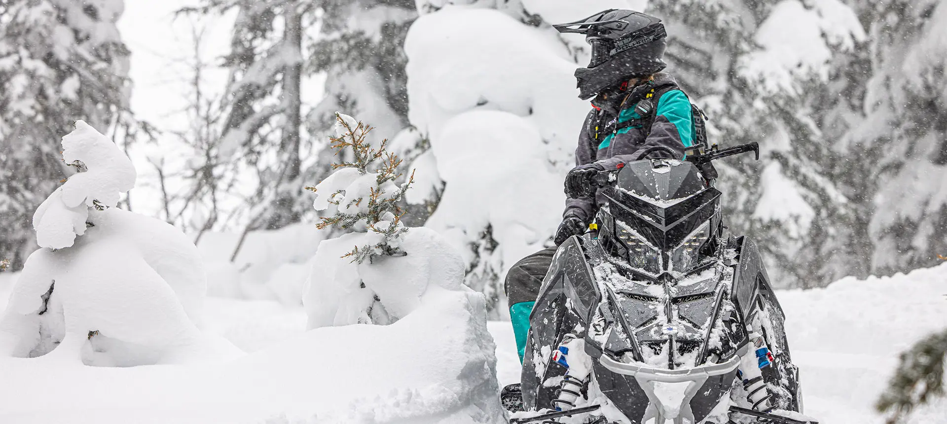 rider after a ride on their polaris rmk khaos slash snowmobile