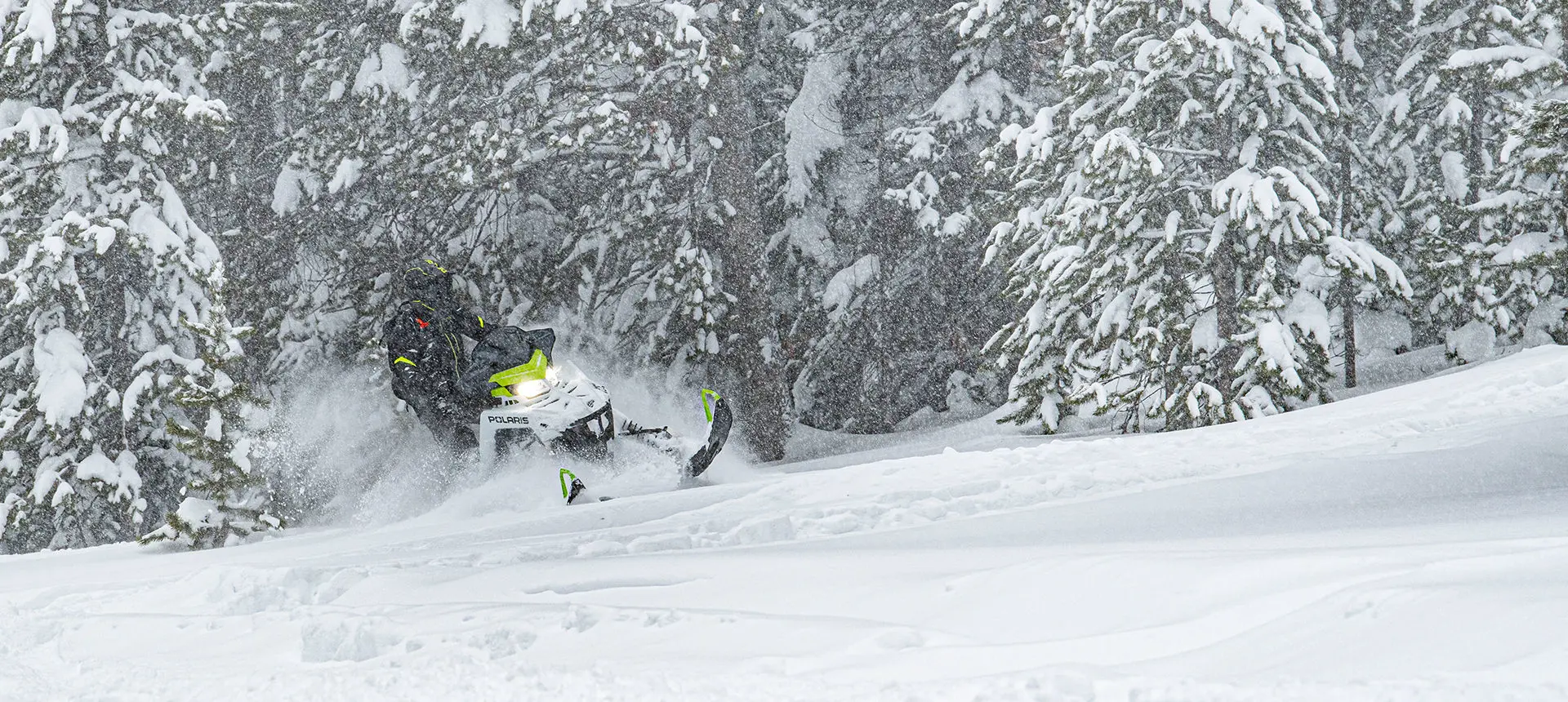 rider on a polaris sks 146 snowmobile