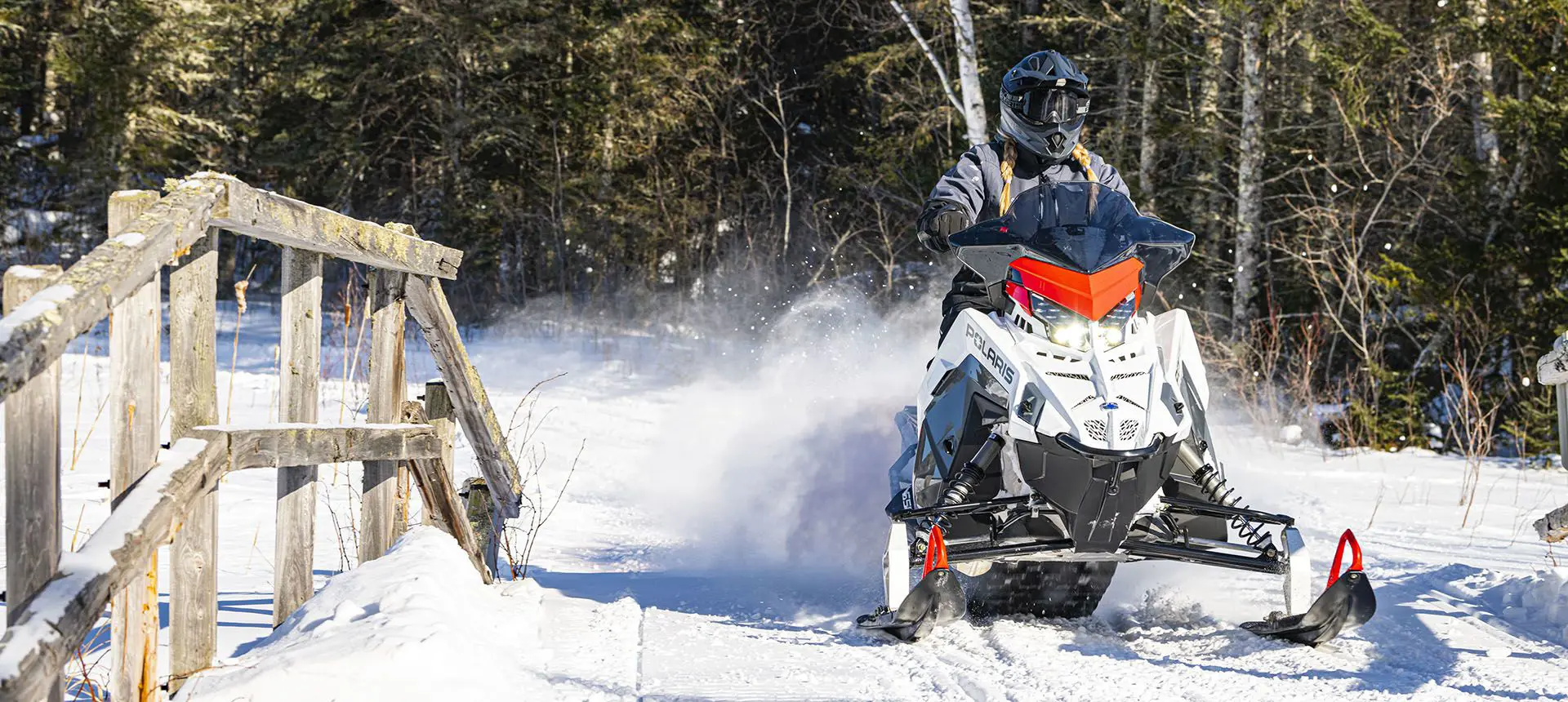 polaris switchback sp snowmobile on a trail