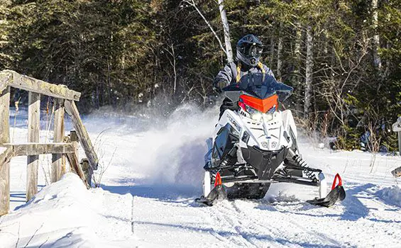 polaris switchback sp snowmobile on a trail