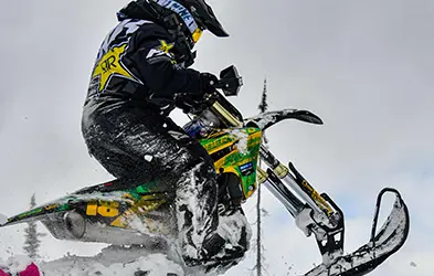 Tessa Mason riding a Timbersled
