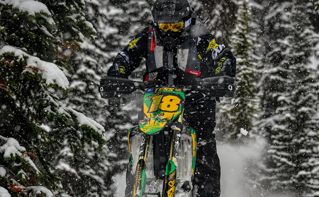 Tessa Mason jump with a Polaris Timbersled