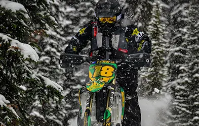 Tessa Mason jump with a Polaris Timbersled