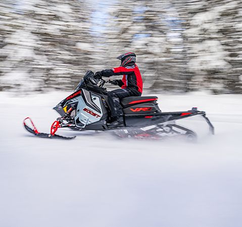 Side profile of a rider on a 2026 Polaris INDY VR1 trail snowmobile showcasing how DYNAMIX tailors to terrain and riding styles.