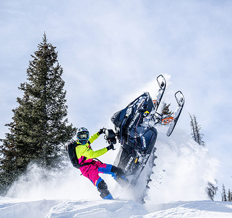Chris Burandt showcasing the all-new 2026 Patriot Boost Polaris PRO RMK 155 Limited Edition mountain snowmobile.