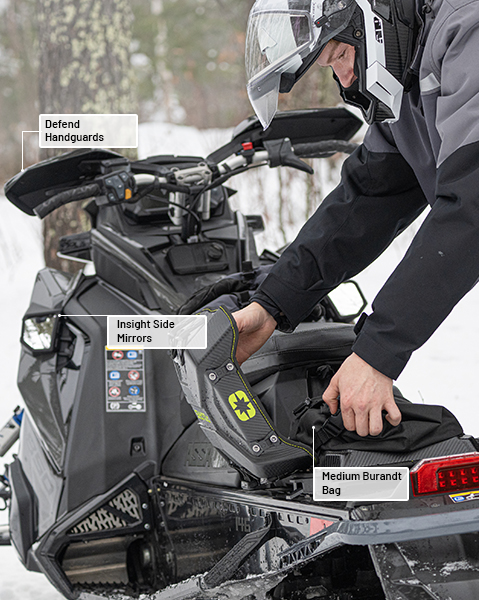 Insight Side Mirrors, Defend Handguards, and Medium Burandt Bag accessories from the Crossover Collection installed on a 2026 Polaris Switchback XC snowmobile.