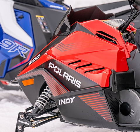 Side profile of the all-new 2027 Polaris INDY 200 youth snowmobile showcasing the fan-cooled 192cc engine.