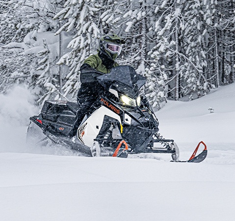 A rider on a 2027 Polaris INDY SP trail sled showcasing the rider-first design.