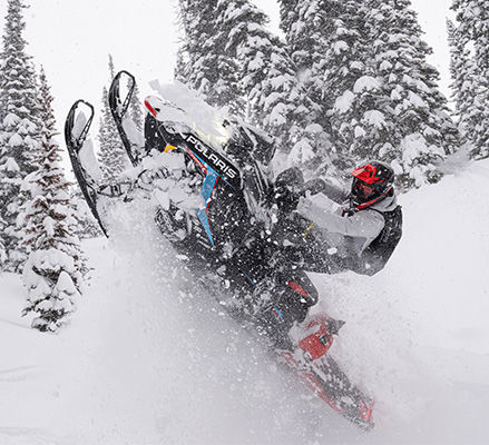 Rider showcasing the lightweight platform on the 2027 Polaris RMK Factory Edition mountain snowmobile.