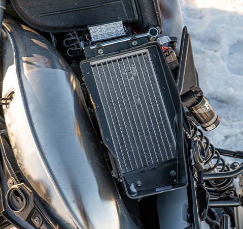 Underhood radiator on a 2027 TITAN Adventure widetrack snowmobile.