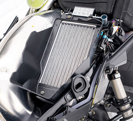 Underhood radiator featured on a 2027 Polaris Voyageur SP 155 sport-utility snowmobile.