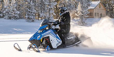 Rider on a Polaris snowmobile with DYNAMIX Suspension showcasing Comfort Mode.
