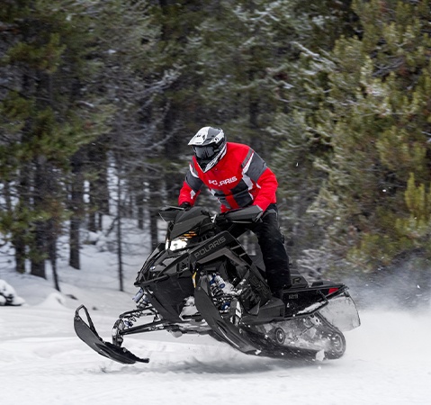 Rider on a Polaris Snowmobile with the Patriot 9R engine showcasing it's race mod architecture.