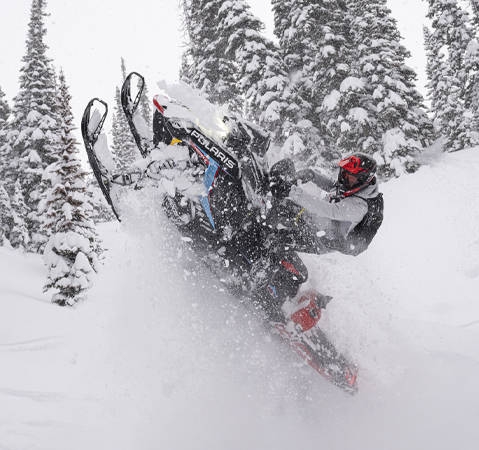 Rider showcasing the power of a 2027 Polaris snowmobile featuring the Patriot Boost engine.