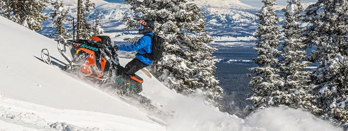 Ken Passaretti riding a Snowmobile