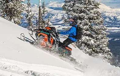 Ken Passaretti riding a Snowmobile