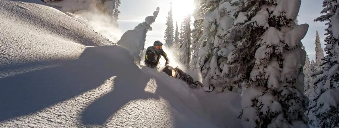 Kyle Smith riding a Snowmobile